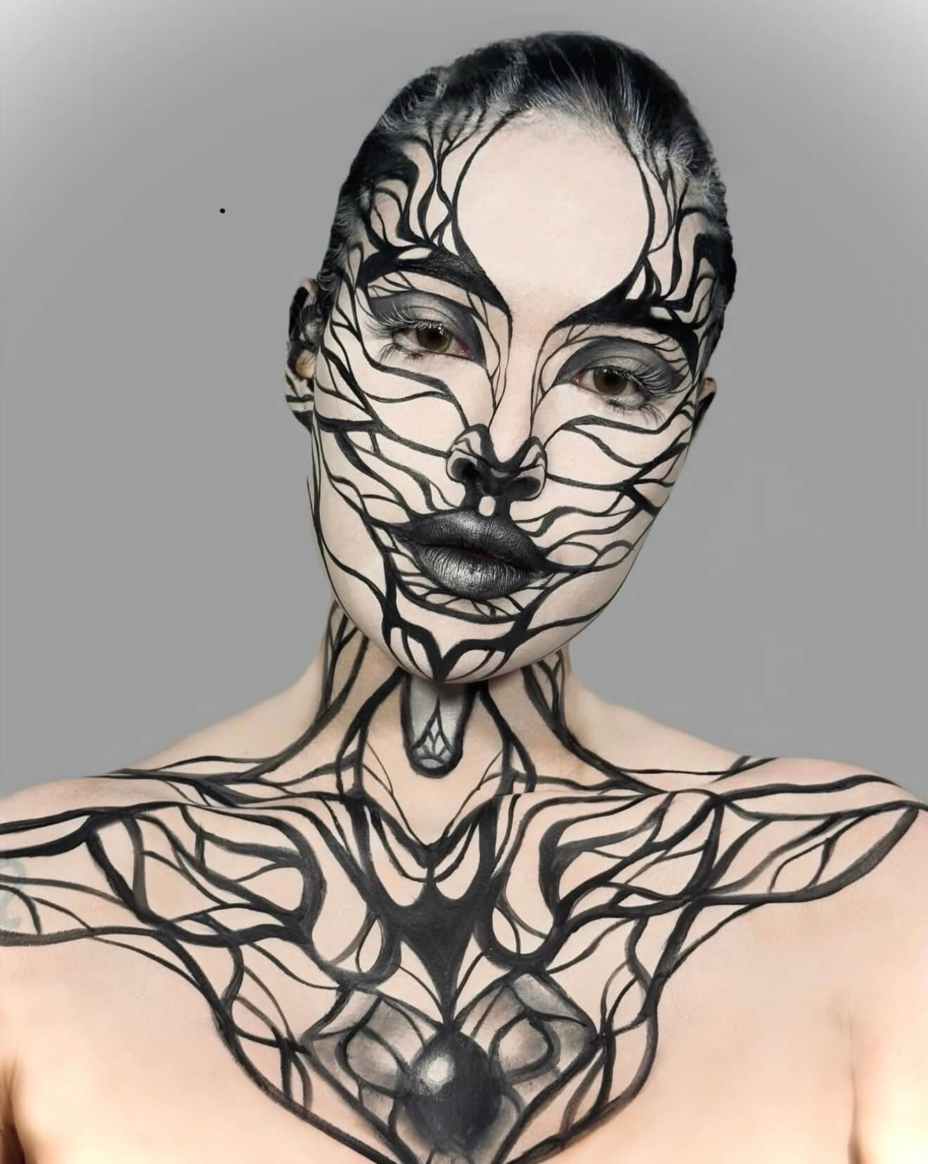 Black and white graphic body paint portrait
